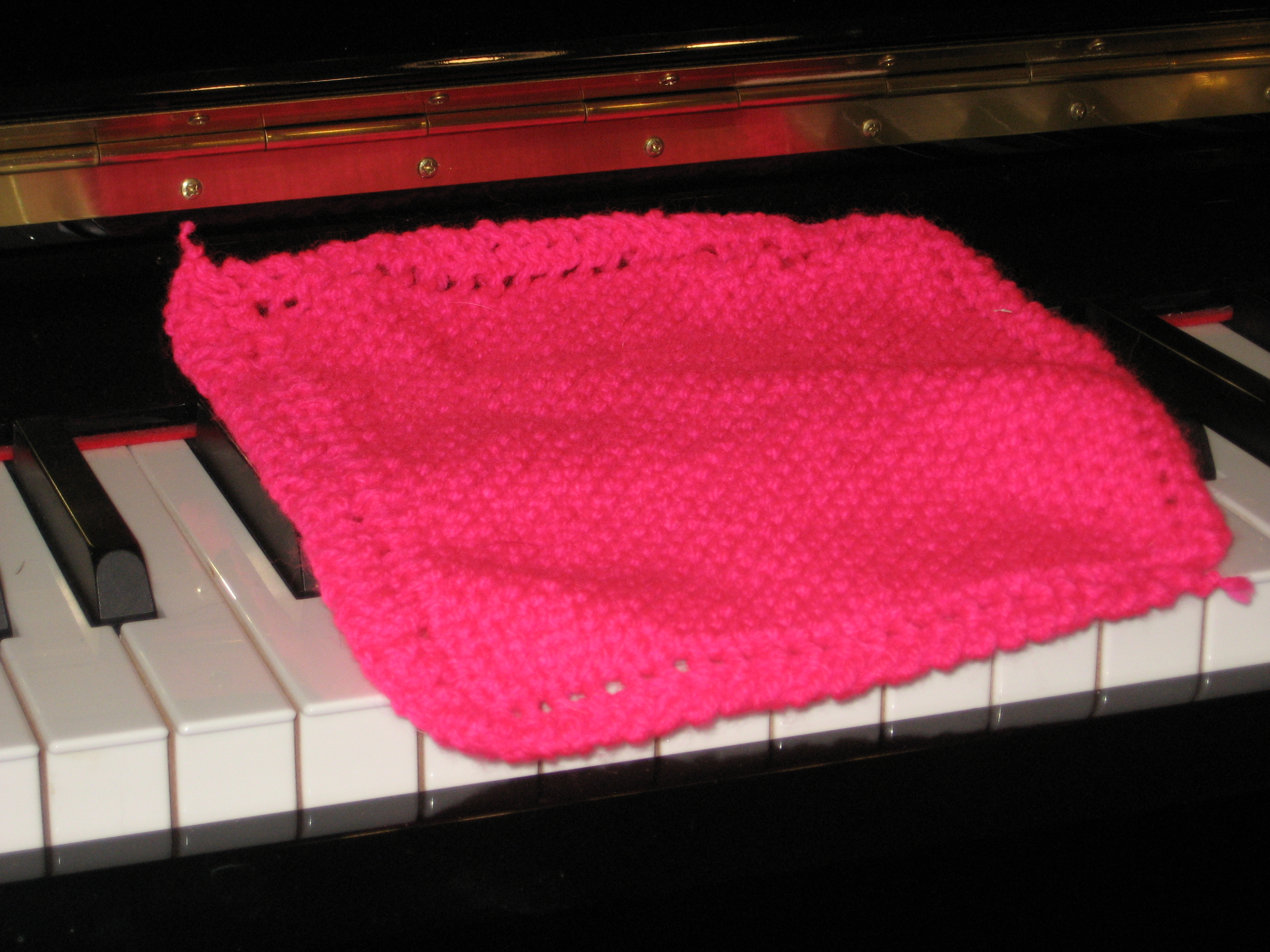 pink hand-knitted washcloth (click to buy on Etsy) 